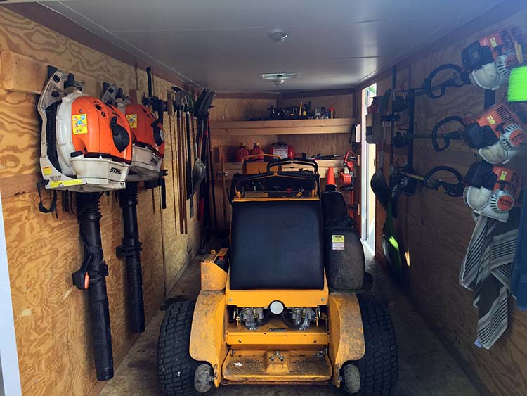 Interior of a truck with landscaping equipment mounts